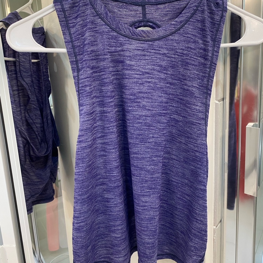 Size 4 lululemon cropped X back tank blue. Loose, long front, short back